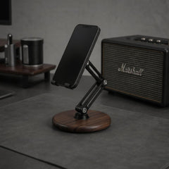 A smartphone displaying a nature background held by the Super Wooden Phone Stand on a wooden desk | Cyber Vintage