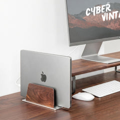 Super Wood Vertical Stand holding a laptop vertically in a clamshell desk setup with external monitor, keyboard, and mouse | Cyber Vintage