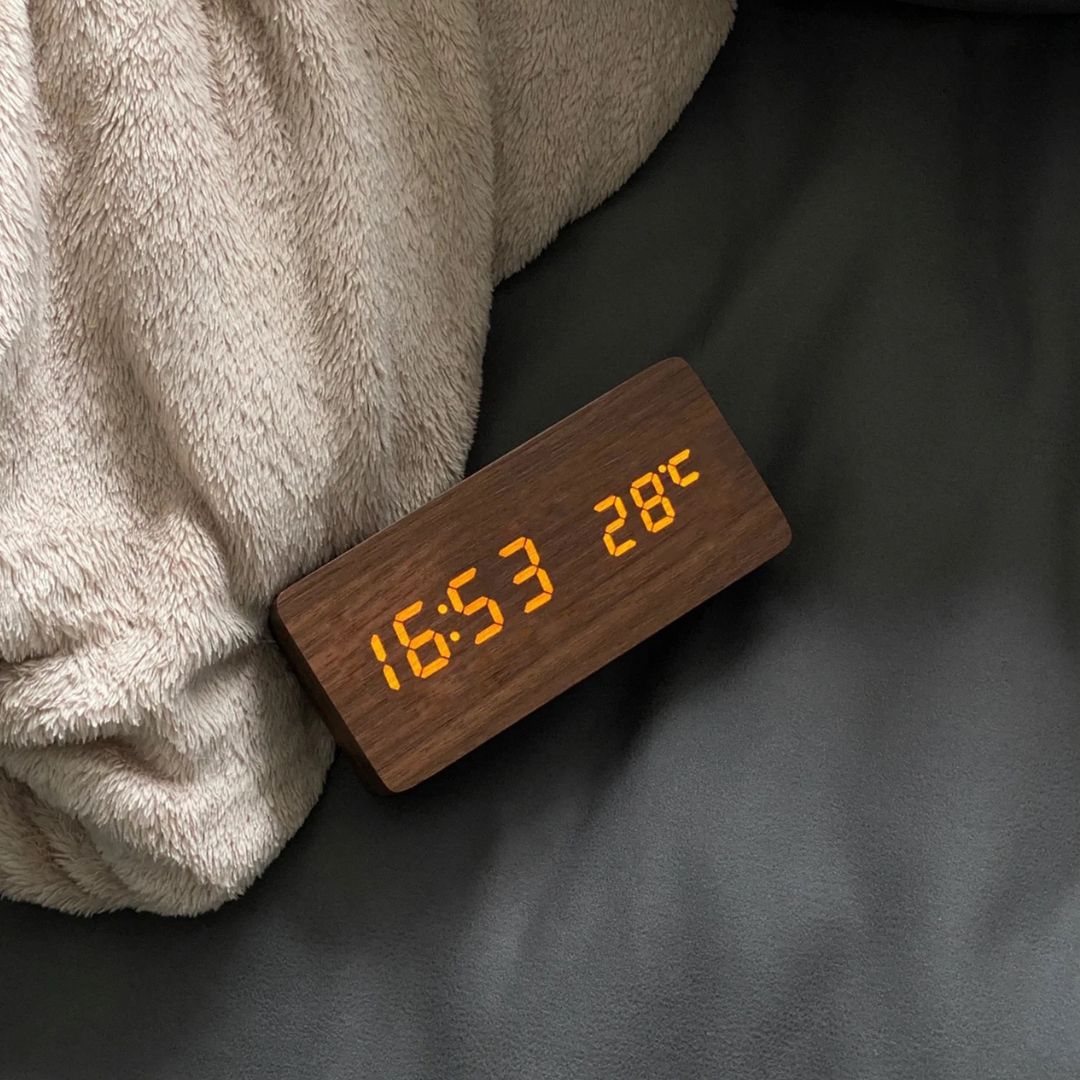 TimberTime Digital Clock displaying time and temperature in orange LED on a dark leather surface | Cyber Vintage