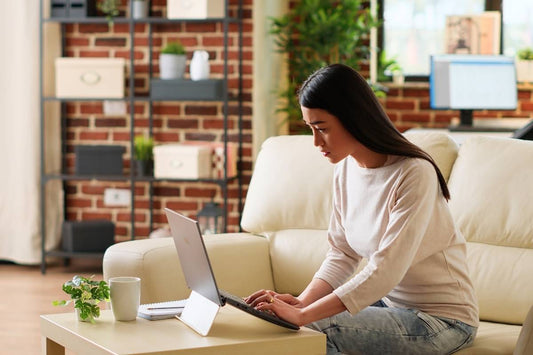 Woman using laptop stand while working