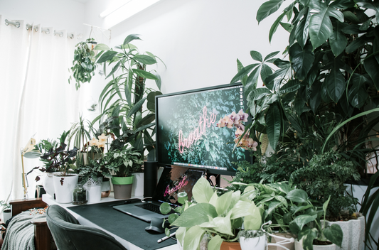 A desksetup with green plants | Cyber Vintage