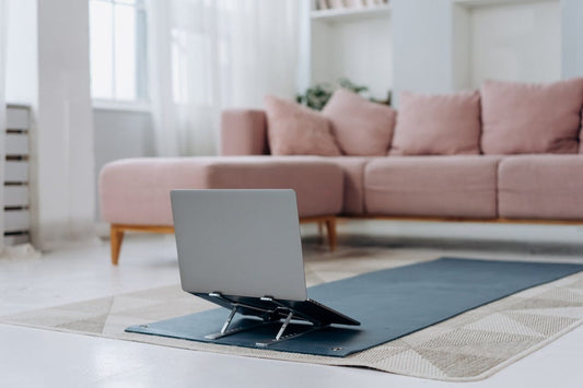 a gray laptop with laptop stand