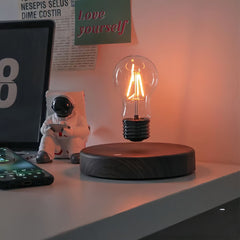 Magic Levitating Lamp Retro Bulb floating above a wooden base next to a smartphone and astronaut figurine | Cyber Vintage