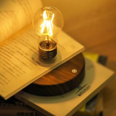 Magic Levitating Lamp Retro Bulb glowing atop an open book, creating a warm reading light | Cyber Vintage