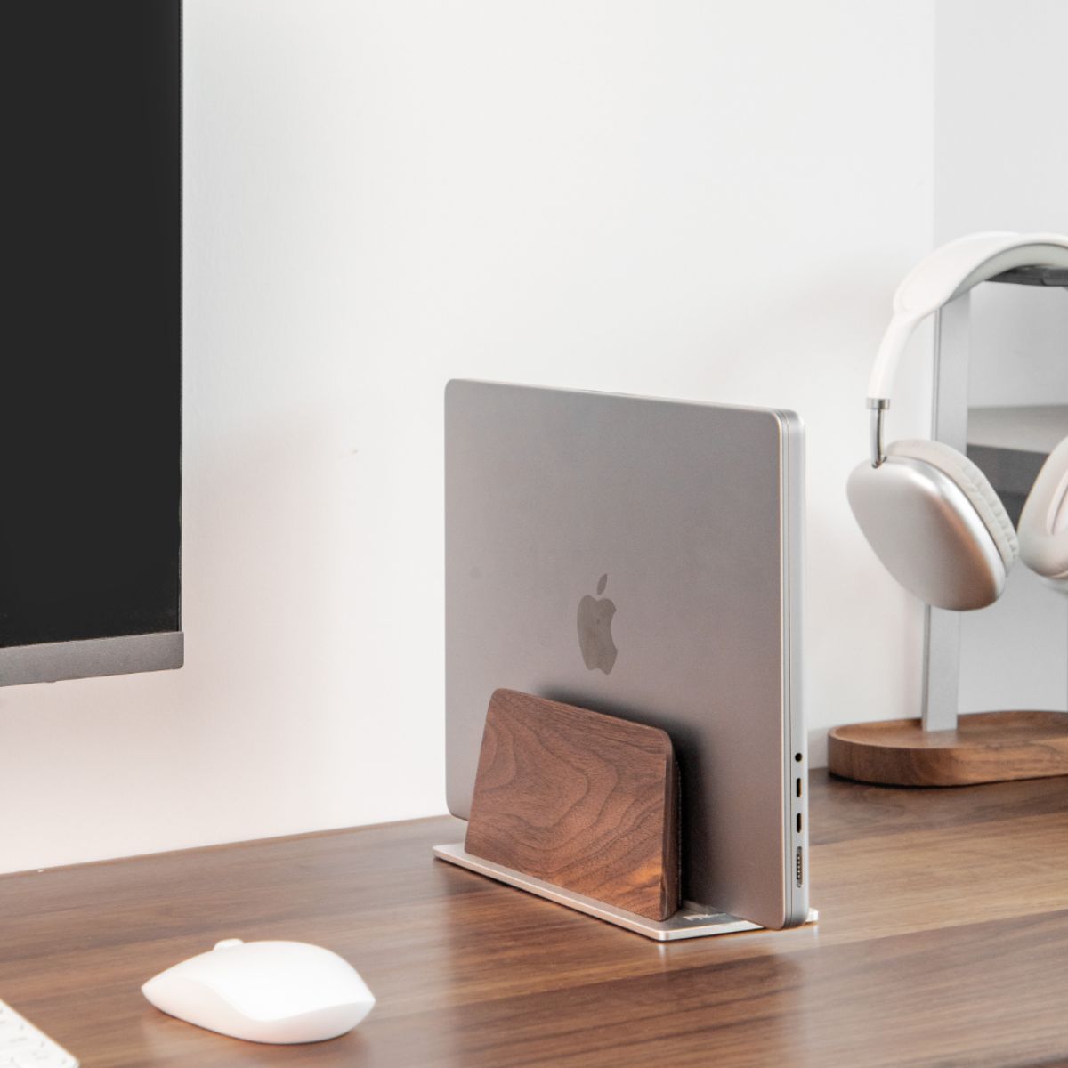 Super Wood Vertical Stand organizing a laptop vertically on a warm wood desk with monitor, mouse, and headphones | Cyber Vintage